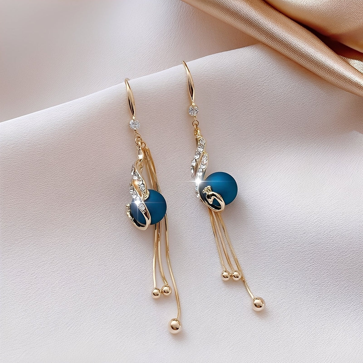Sheynn – Festive Earrings with Blue Pearls